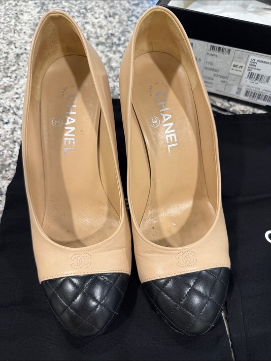 CHANEL Shoes - CHANEL Two-Tone Beige Leather Pumps with Black Quilted Cap Toe